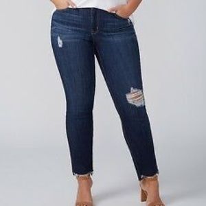 Lane Bryant distressed jeans with frayed edges.